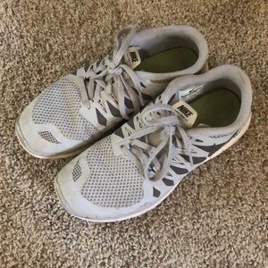 Light gray Nike Free 5.0s
